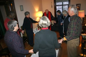 Mass in the Living Room of the Monastery: Congregants pray "Our Father"