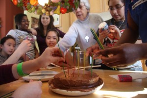 Sr. Mary Virginia helps with the birthday candle placement