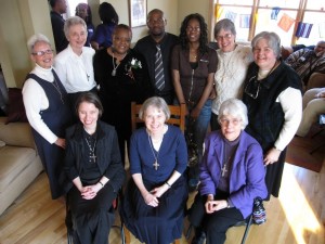 Visitation Sisters surrounding Mary and Oshea