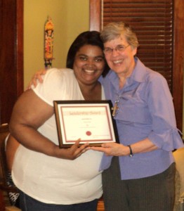 Bianca Franks embraced by Sr. Mary Frances Reis, VHM