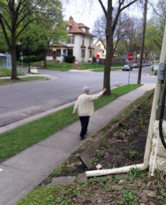 S. Mary Margaret sprinkling the holy water around our flower gardens